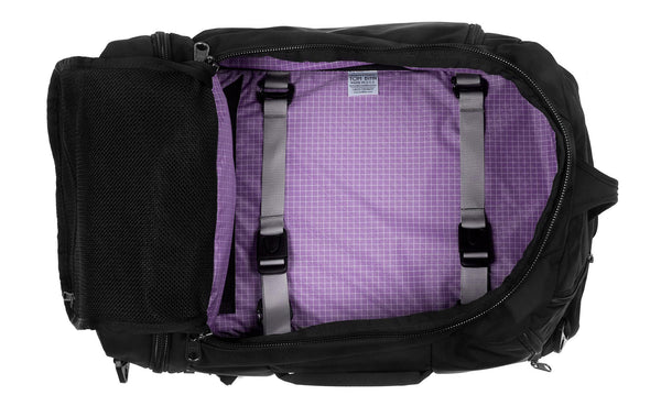 An open Techonaut 30 with a Black exterior and a Wisteria (pale purple with white grid) interior.